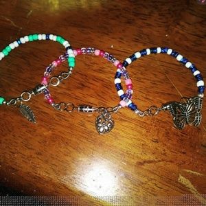 Handmade beaded bracelets , necklaces or keychains